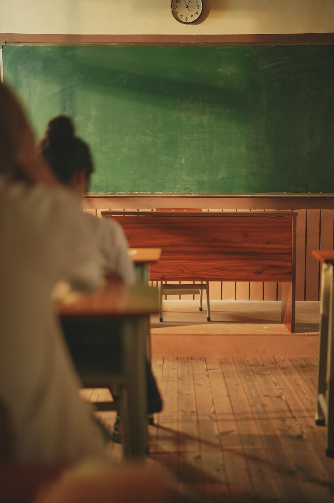 Instructor teaching a group in a bright classroom