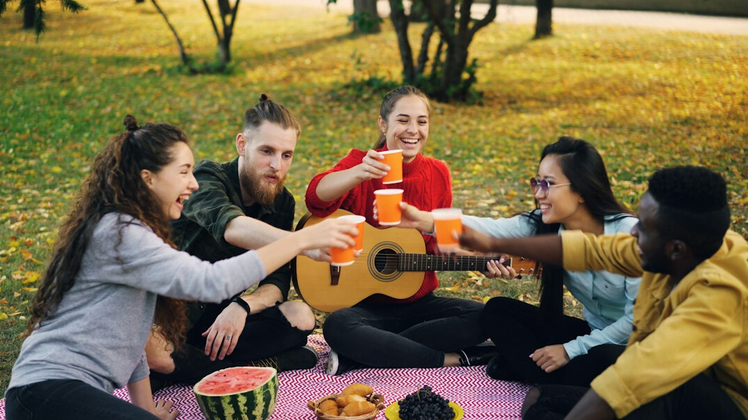 Group of friends smiling together outdoors