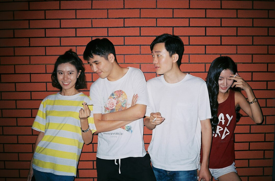 Group of young friends talking and laughing together