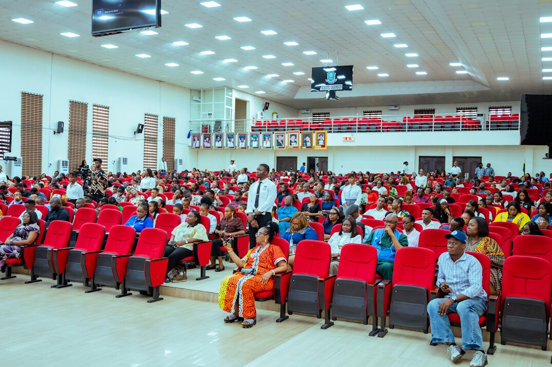 Audience listening to a presentation in a conference hall
